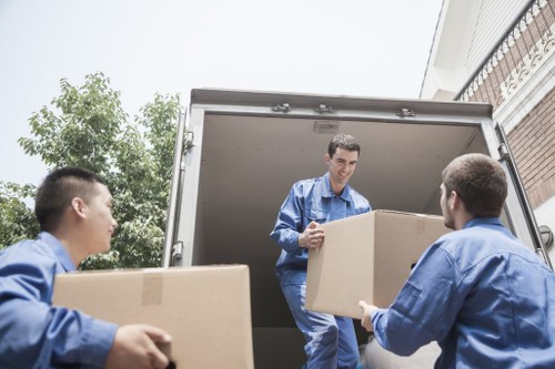 Crew loading a large wardrobe from a Victorian terraced house