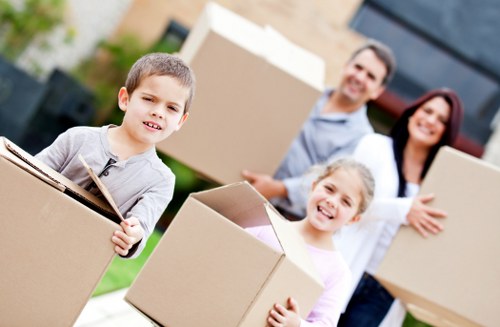 Professional movers handling a household move in London