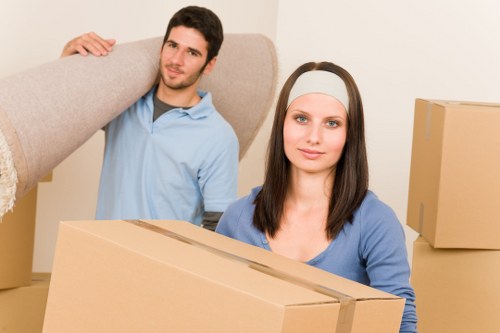 Team carefully unpacking fragile items in new home