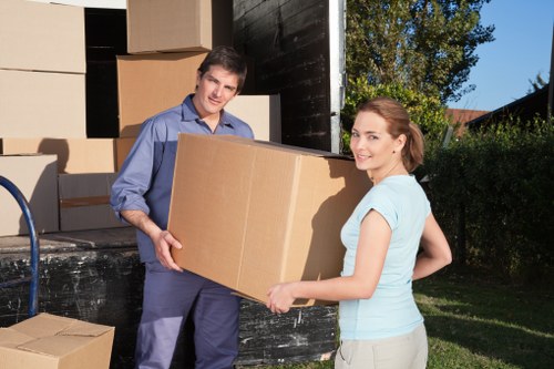 Skilled movers handling furniture disassembly